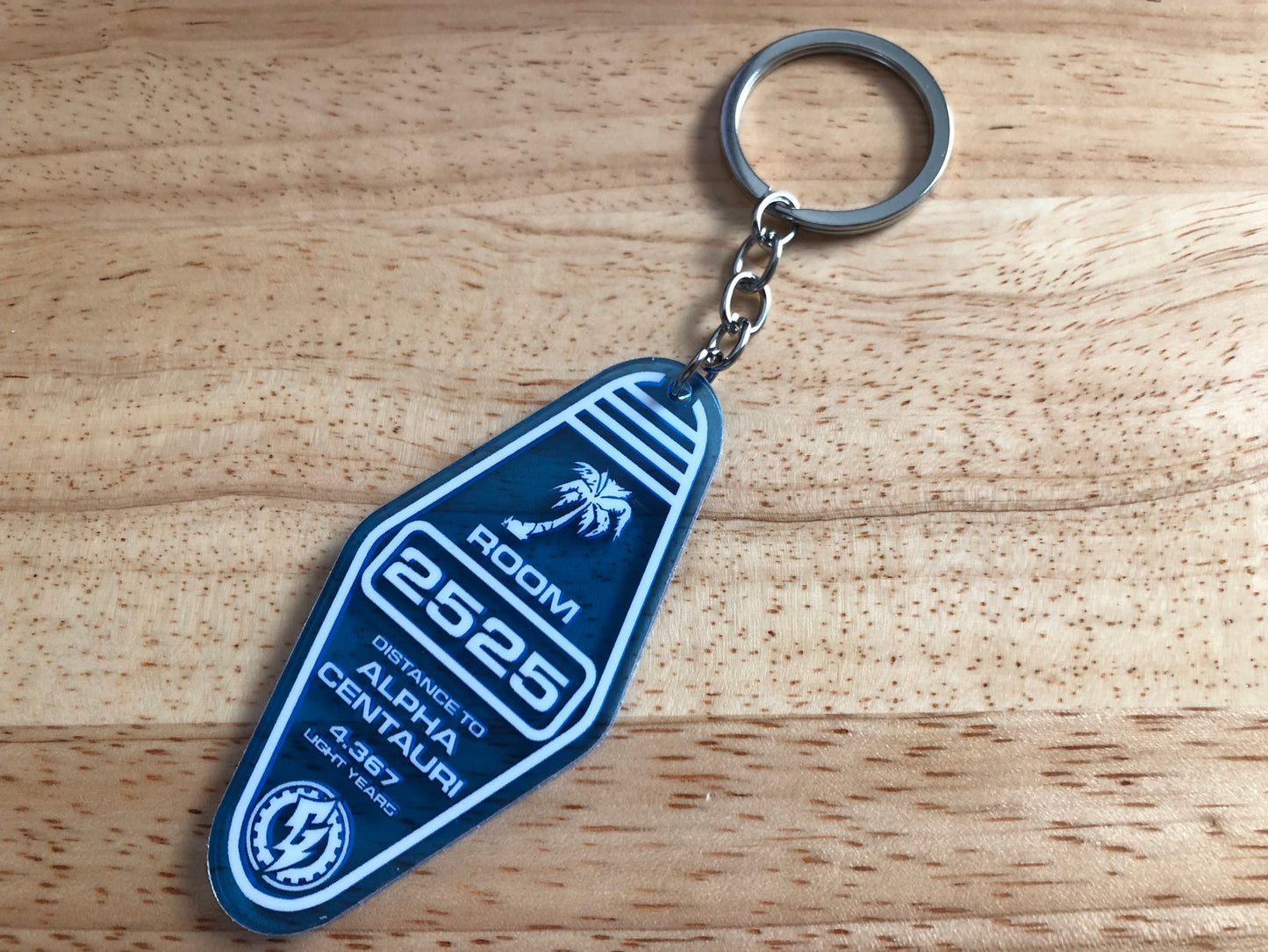 ALPHA CENTAURI MOTEL KEYCHAIN